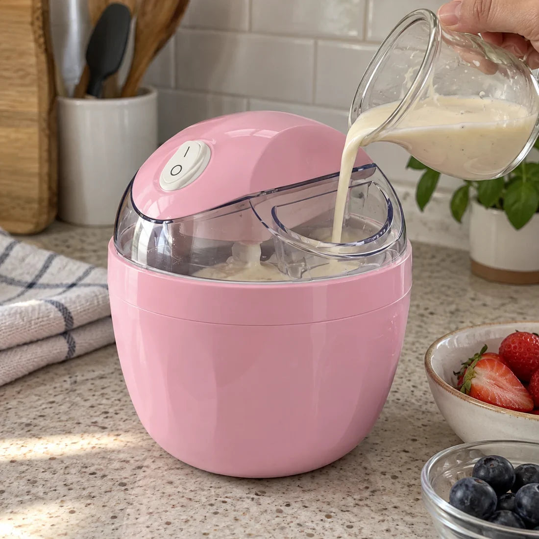 Frostly pink maker with chilled mixture being poured through its lid